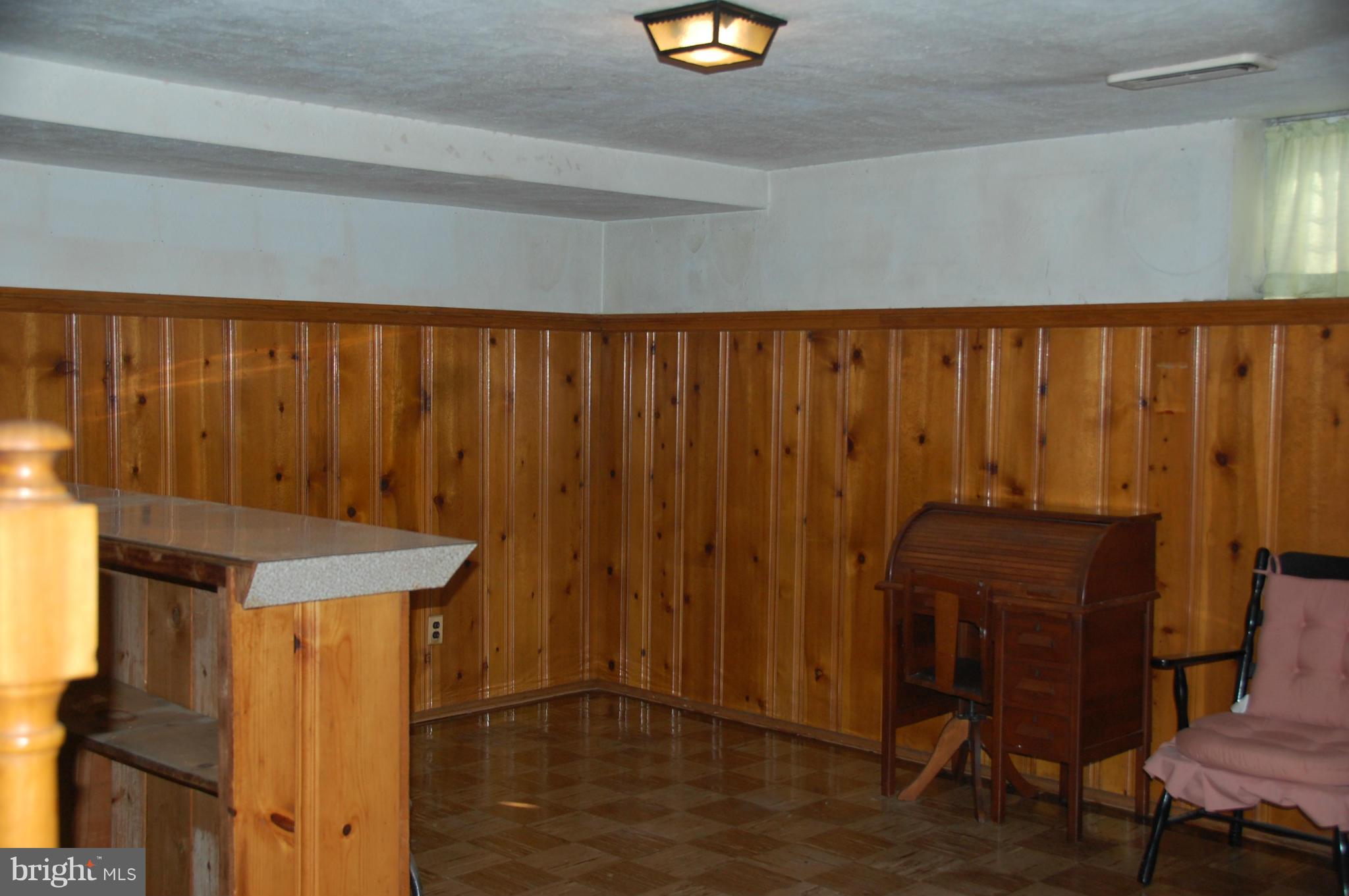 1928 Church Road Dundalk, MD 21222 - Photo 13 of 18 a bathroom with a window and wooden walls