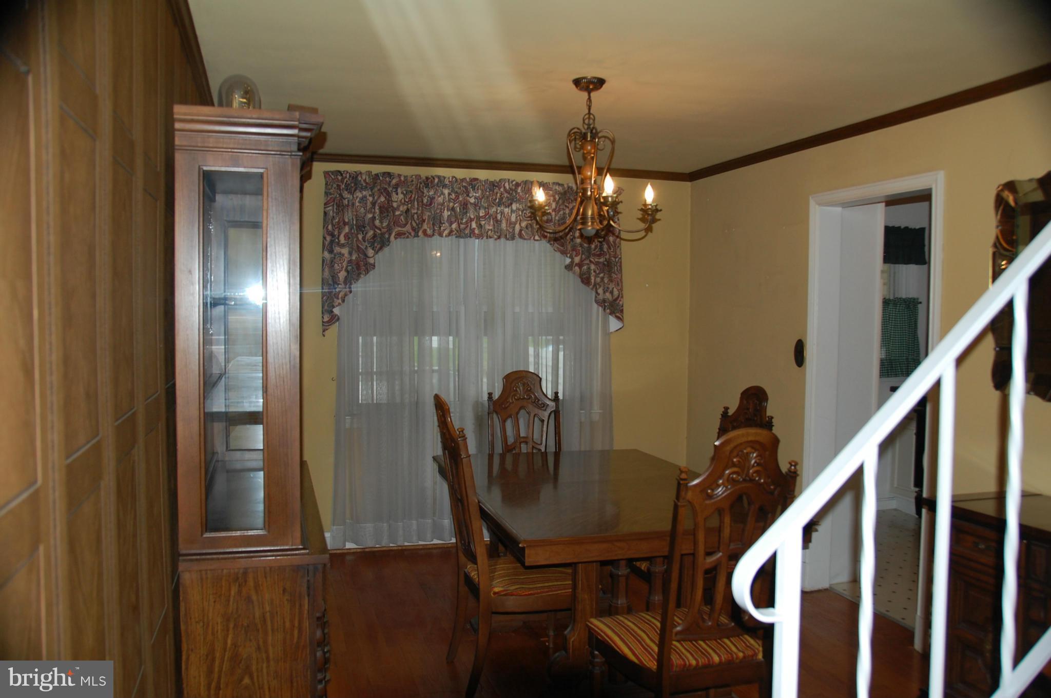 1928 Church Road Dundalk, MD 21222 - Photo 3 of 18 a view of a dining room with furniture and chandelier