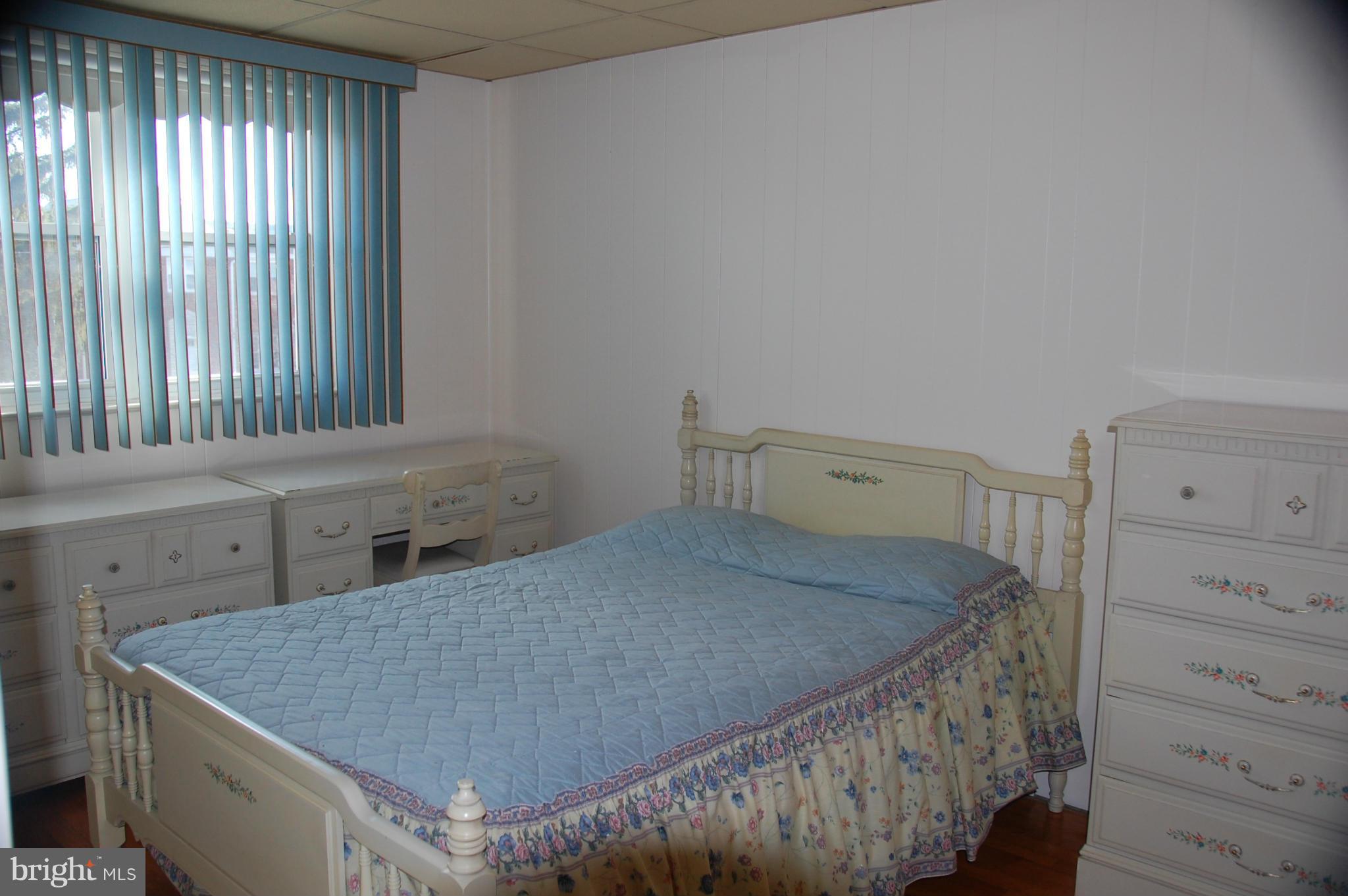 1928 Church Road Dundalk, MD 21222 - Photo 7 of 18 a bedroom with a bed and a window