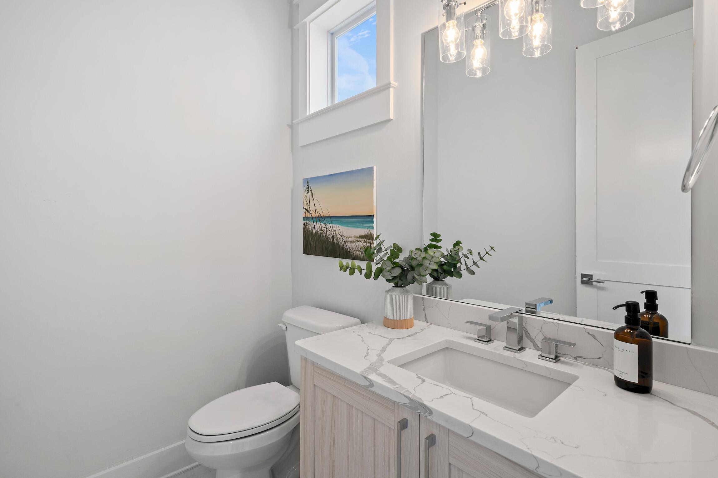 59 Lifeguard Loop Inlet Beach Inlet Beach, FL 32461 - Photo 22 of 47 a bathroom with a granite countertop sink a toilet and mirror
