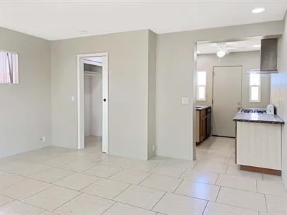 a view of a kitchen with white cabinets