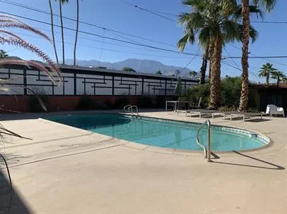 a view of swimming pool with outdoor seating