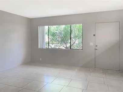 a view of an empty room with a window