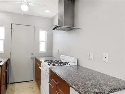 a kitchen with a stove and a sink