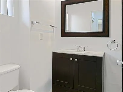 a bathroom with a double vanity sink and mirror