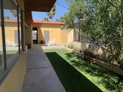 a view of a house with a backyard