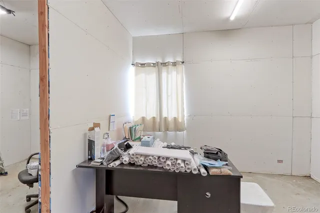 a bedroom with a bed and a table