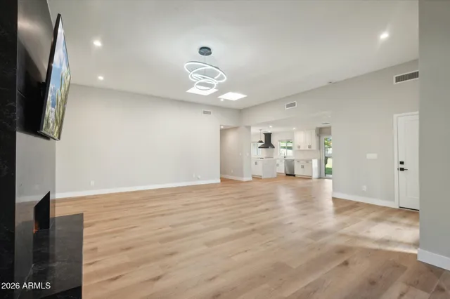 a view of livingroom with hardwood floor and a ceiling fan