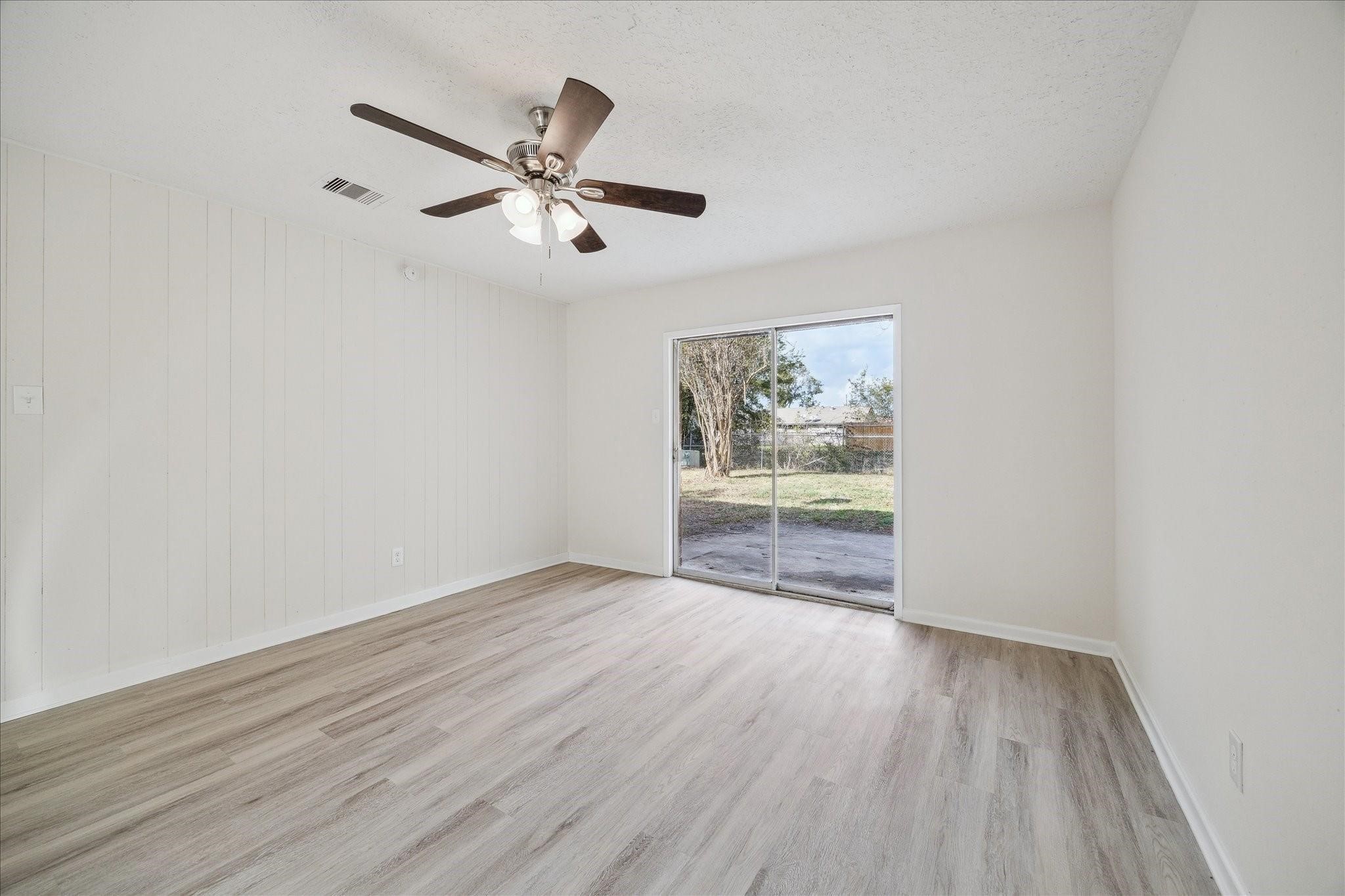 5515 Knightwood Street Houston, TX 77016 - Photo 4 of 11 a view of empty room with wooden floor