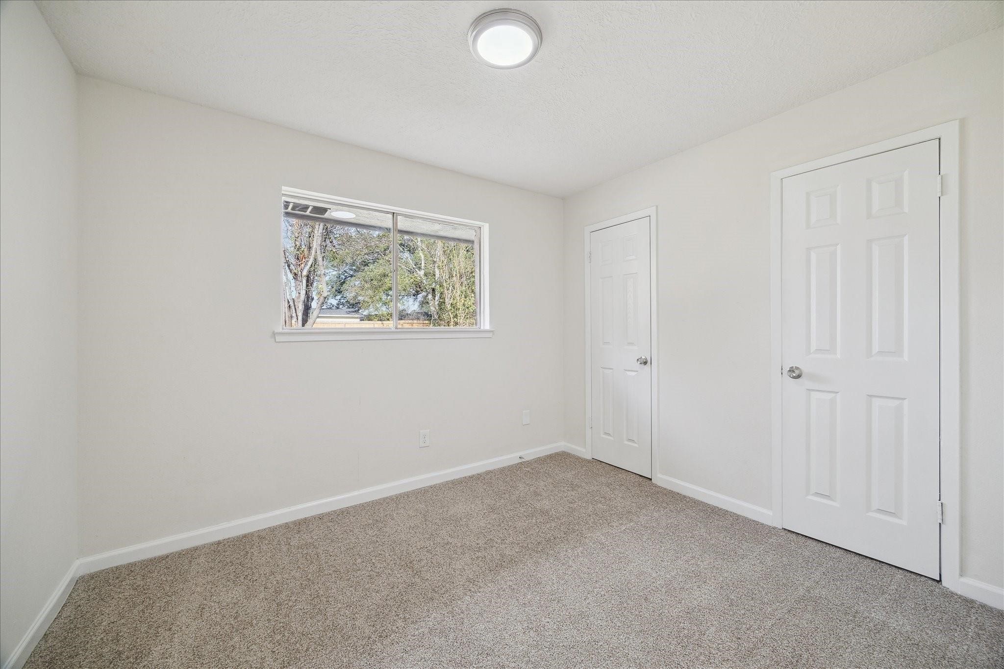 5515 Knightwood Street Houston, TX 77016 - Photo 6 of 11 an empty room with windows