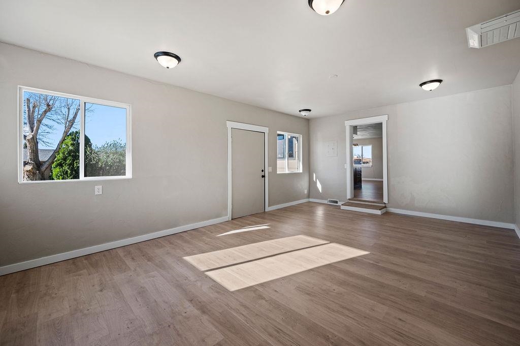 508 Rosa Street Palisade, CO 81526 - Photo 15 of 18 a view of an empty room with wooden floor and a window