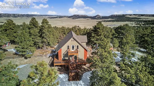 a aerial view of a house with a lake view
