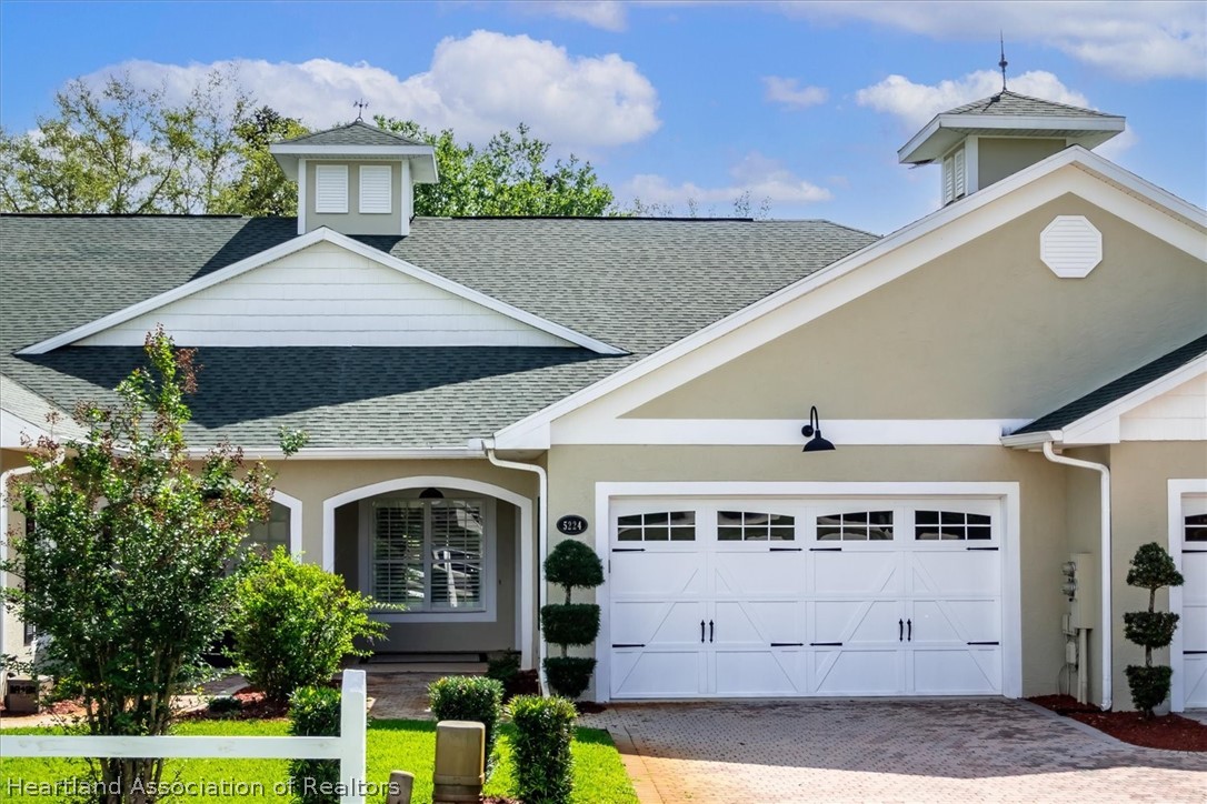 5224 Haw Branch Road Sebring, FL 33875 - Photo 1 of 40 a front view of a house with garden