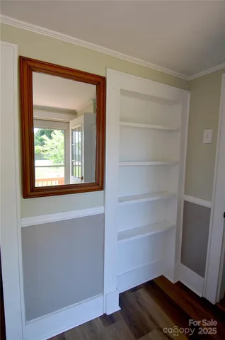 a view of storage and utility room with closet