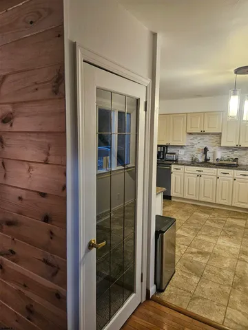 a kitchen with stainless steel appliances granite countertop a sink and cabinets