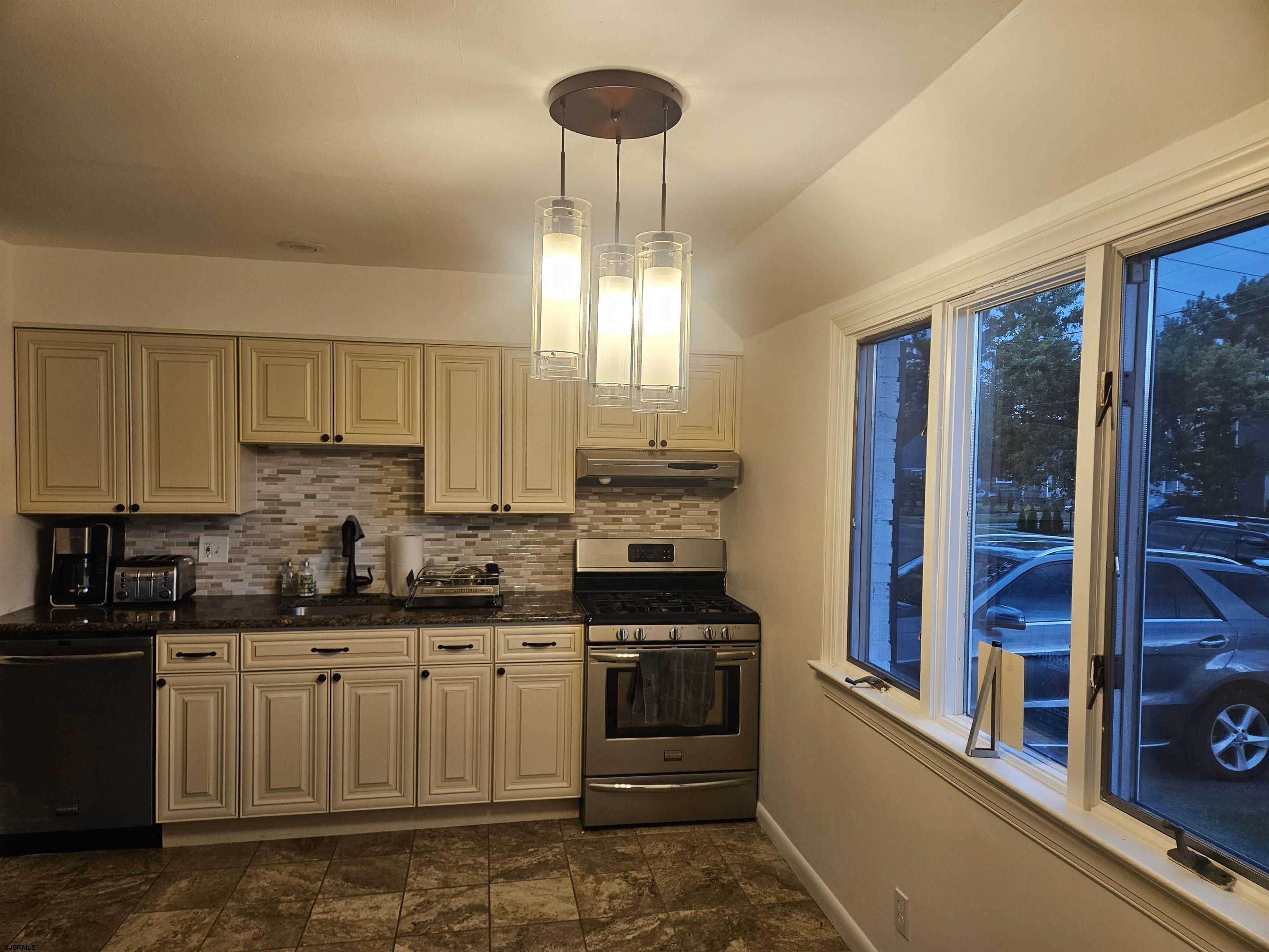 33 Mac Knight Drive Clementon, NJ 08021 - Photo 16 of 51 a kitchen with a stove a sink and a refrigerator