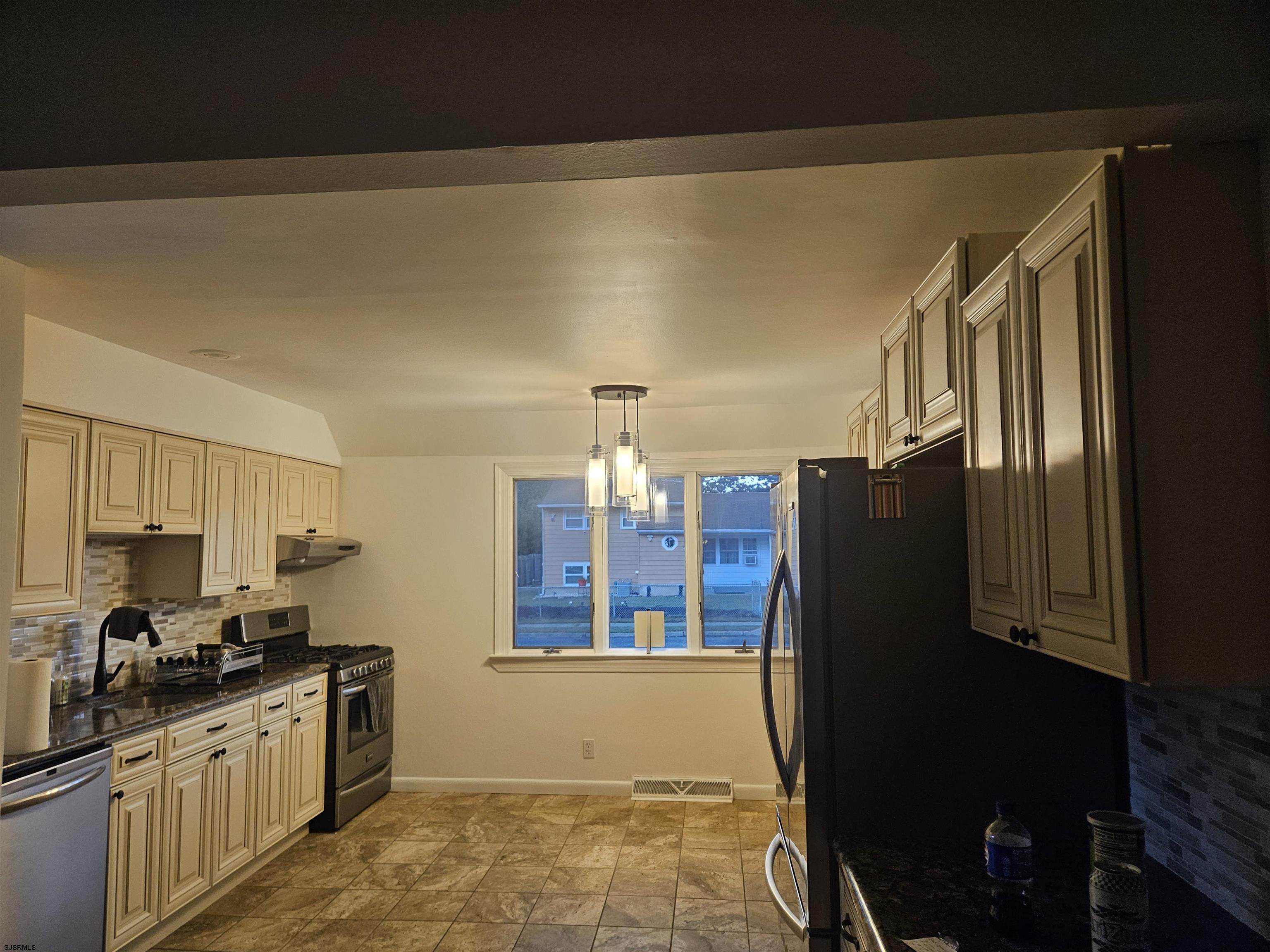 33 Mac Knight Drive Clementon, NJ 08021 - Photo 17 of 51 a kitchen with granite countertop a refrigerator a stove and a sink