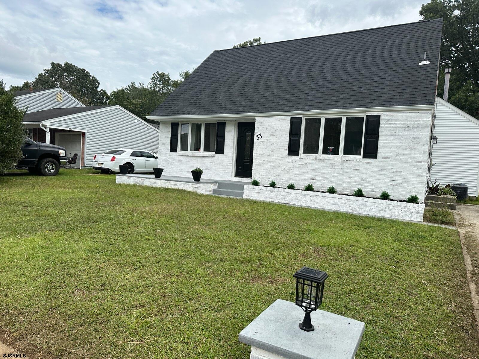 33 Mac Knight Drive Clementon, NJ 08021 - Photo 2 of 51 a front view of a house with garden