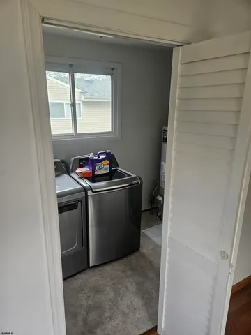 a utility room with window washer and dryer