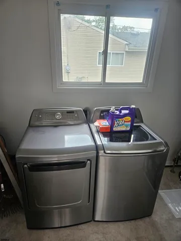 a utility room with washer and dryer