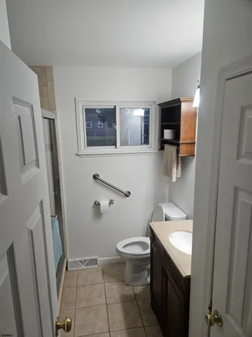 a bathroom with a toilet and a sink