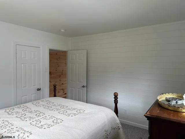 a bedroom with a bed and a table