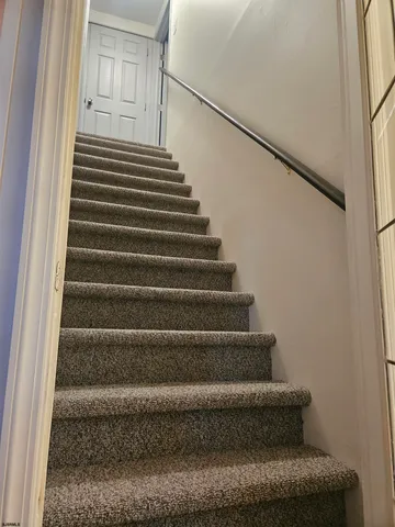 a bedroom with a bed and cabinets