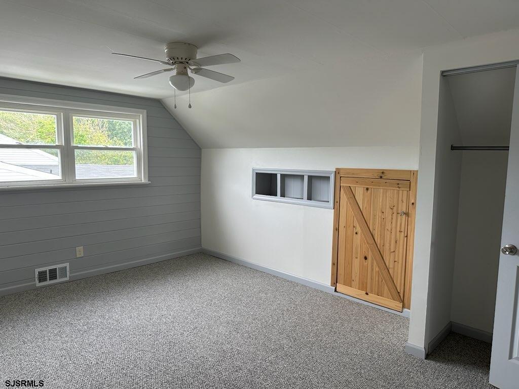 33 Mac Knight Drive Clementon, NJ 08021 - Photo 48 of 51 an empty room with a window and a ceiling fan