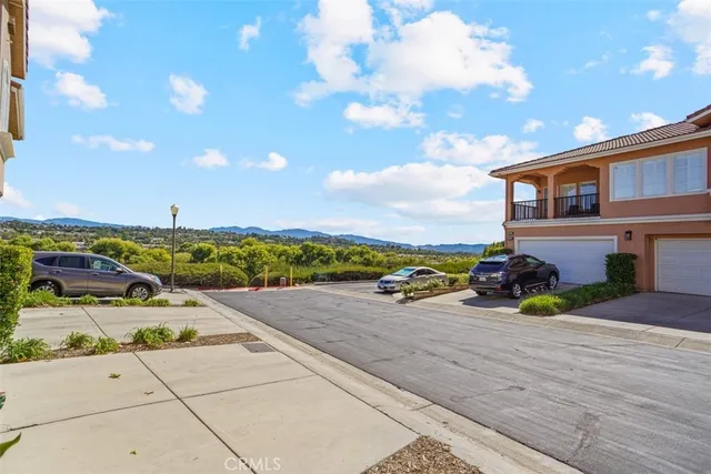 a backyard of a house with a yard and outdoor seating