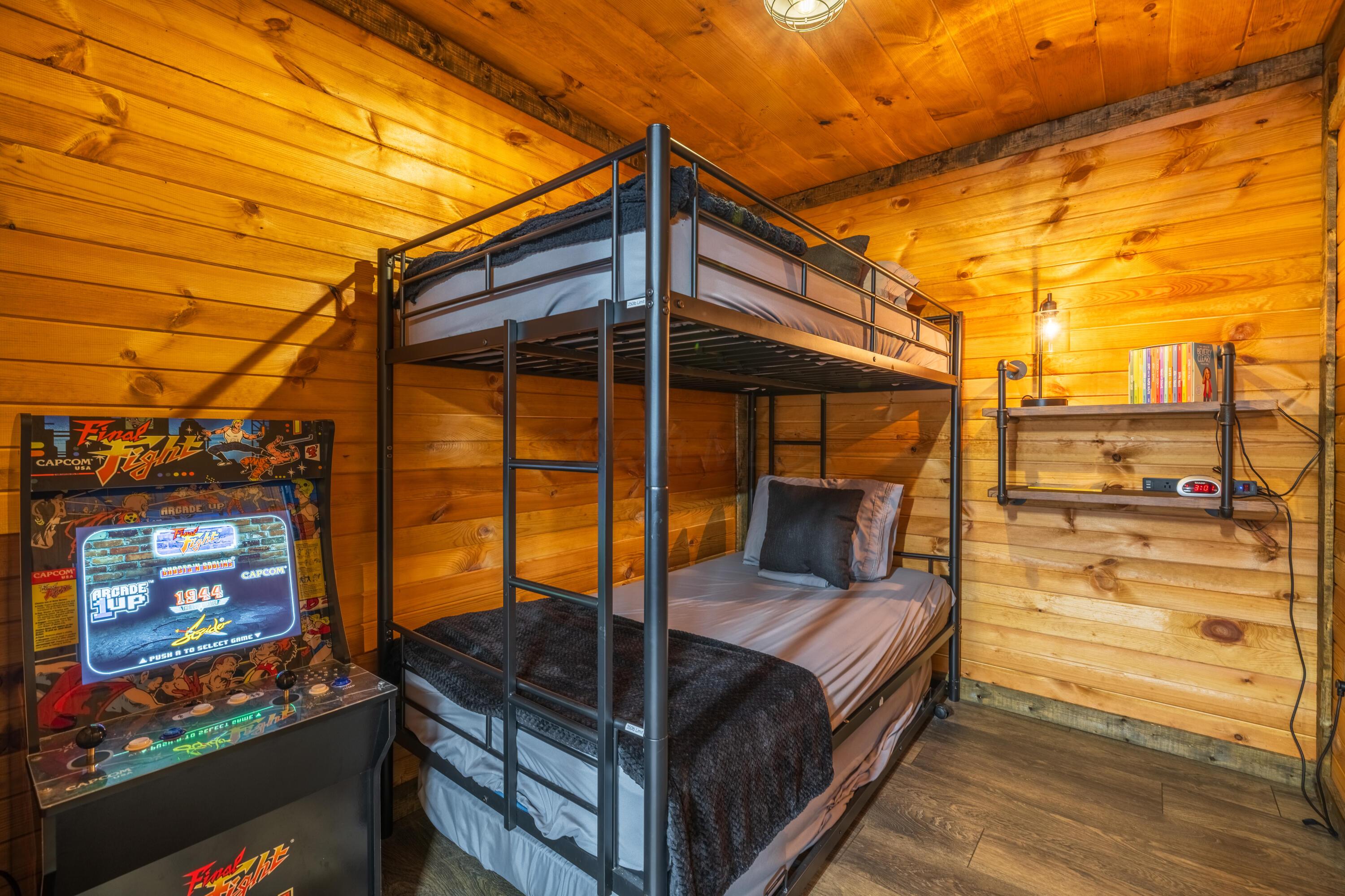 344 Skaggs Road Londonderry, OH 45647 - Photo 44 of 57 Sage Hill Cabin bunk room with 2 beds and an arcade game