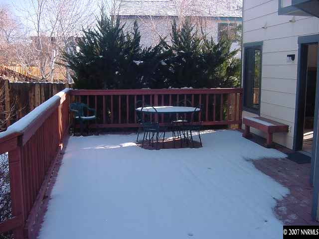 583 Citadel Road Reno, NV 89503 - Photo 6 of 7 a balcony with wooden floor and outdoor seating
