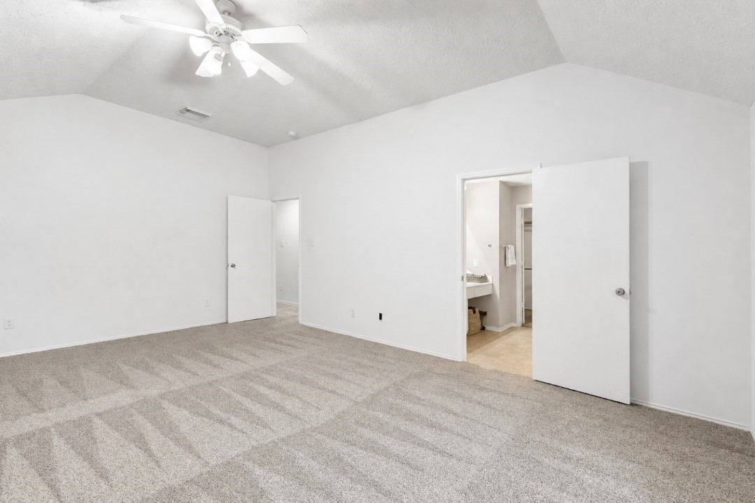 11430 Moonlight Ridge Drive Humble, TX 77396 - Photo 10 of 15 a view of an empty room with a chandelier fan