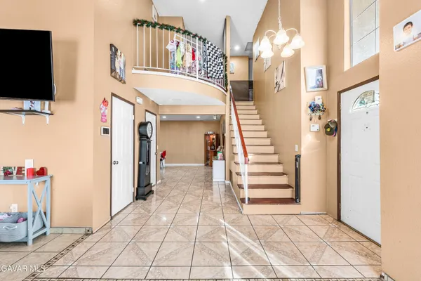 a kitchen with a stove and white cabinets