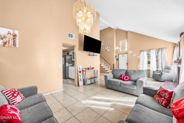 a living room with lots of furniture and toys
