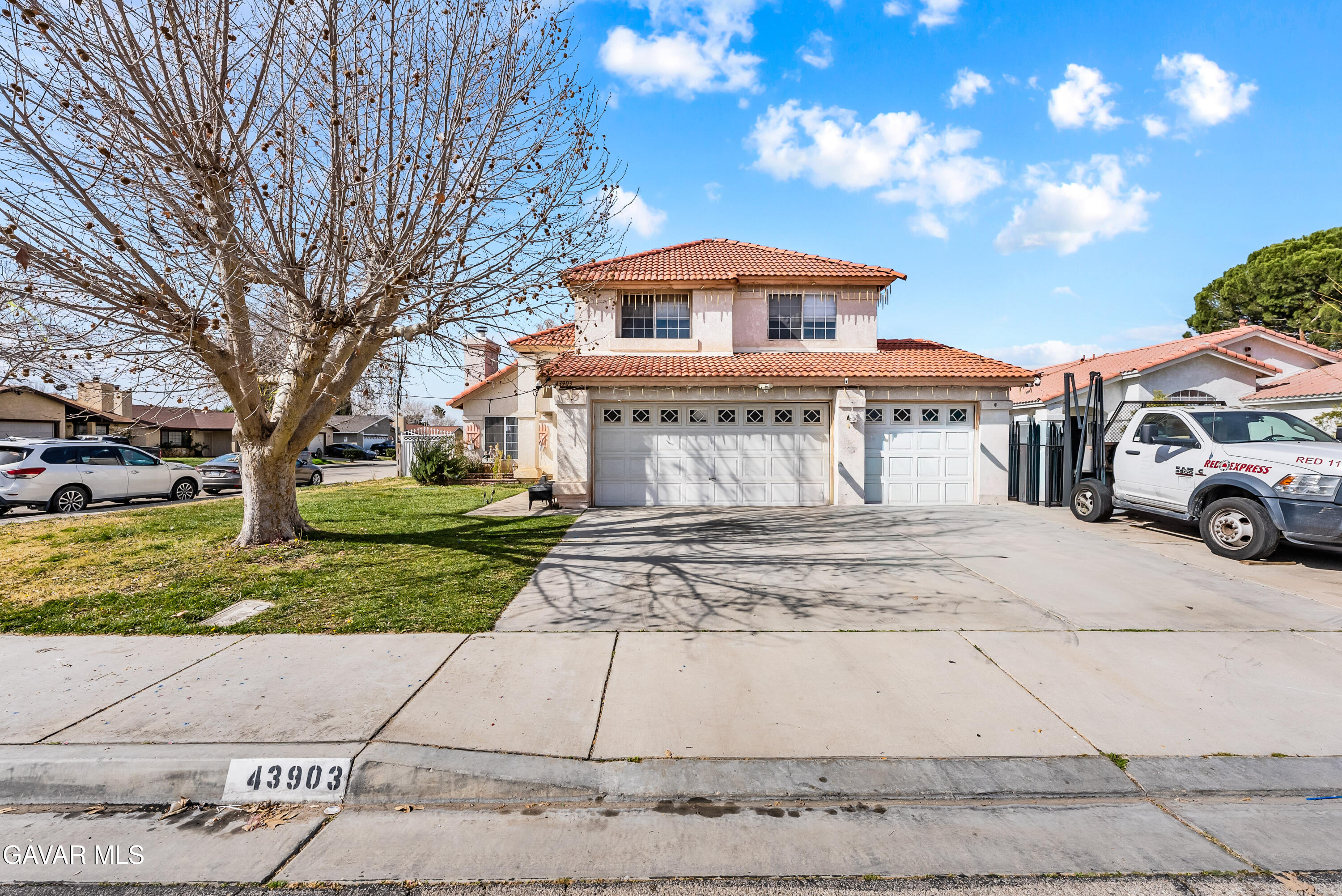 43903 11th Street East Lancaster, CA 93535 - Photo 2 of 45 a front view of a house with a yard