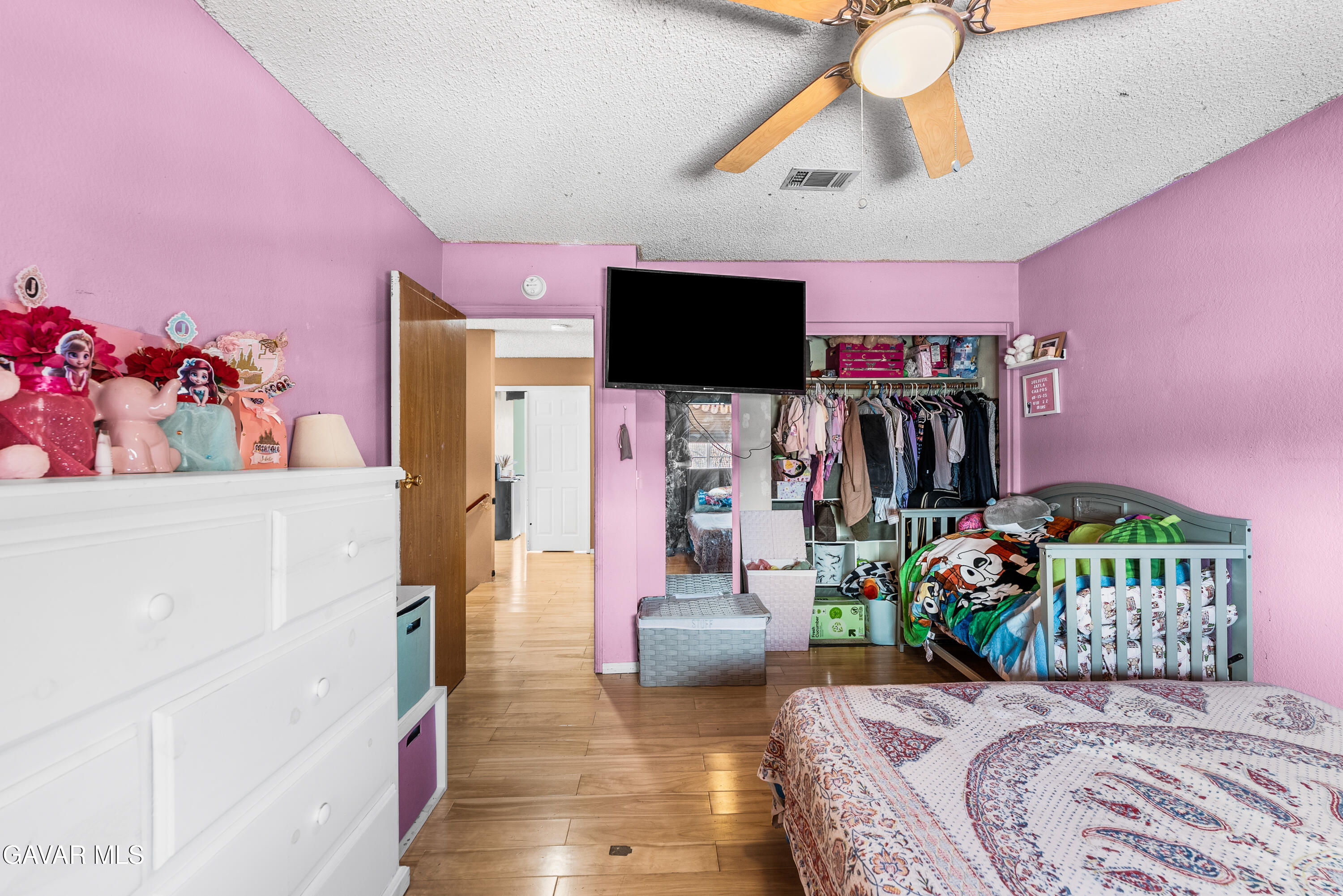 43903 11th Street East Lancaster, CA 93535 - Photo 35 of 45 a bedroom with furniture and a flat screen tv