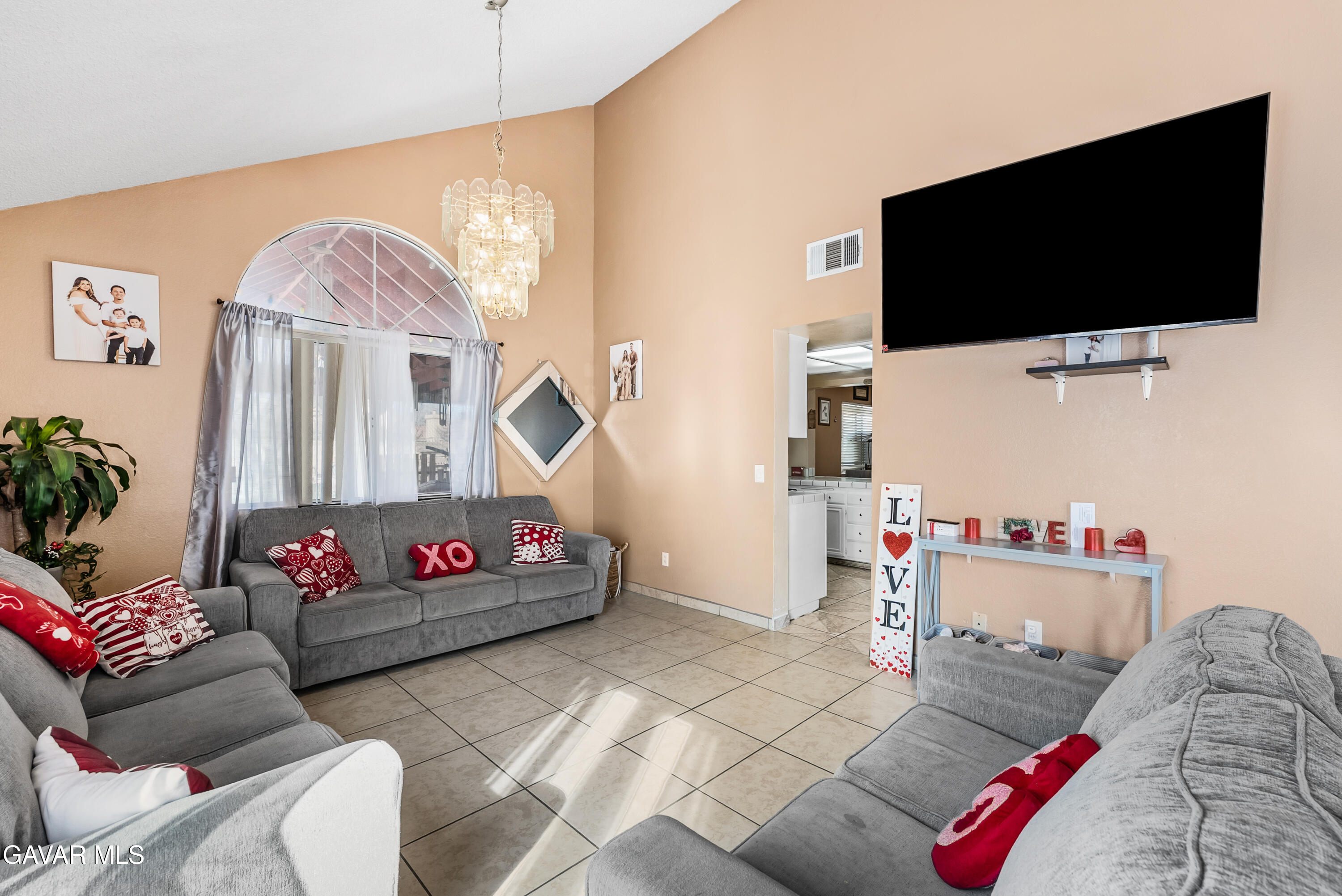 43903 11th Street East Lancaster, CA 93535 - Photo 9 of 45 a living room with furniture and a flat screen tv