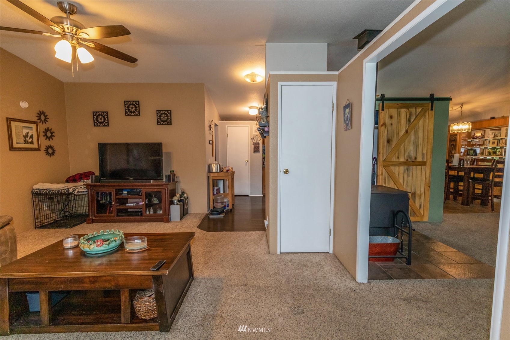 11205 180th Lane Southwest Rochester, WA 98579 - Photo 11 of 33 a living room with furniture and a flat screen tv
