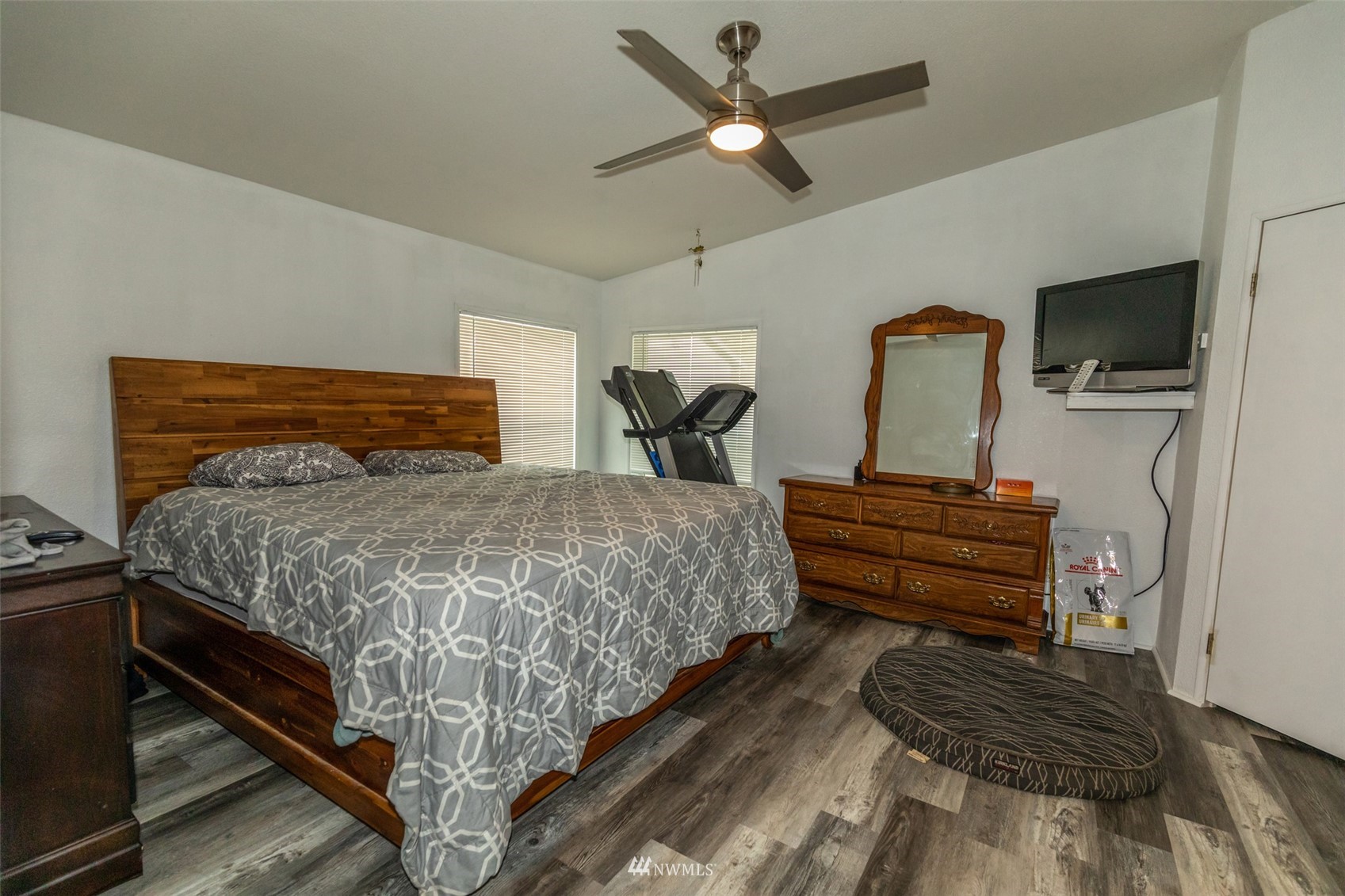 11205 180th Lane Southwest Rochester, WA 98579 - Photo 13 of 33 a bedroom with a bed and a chandelier