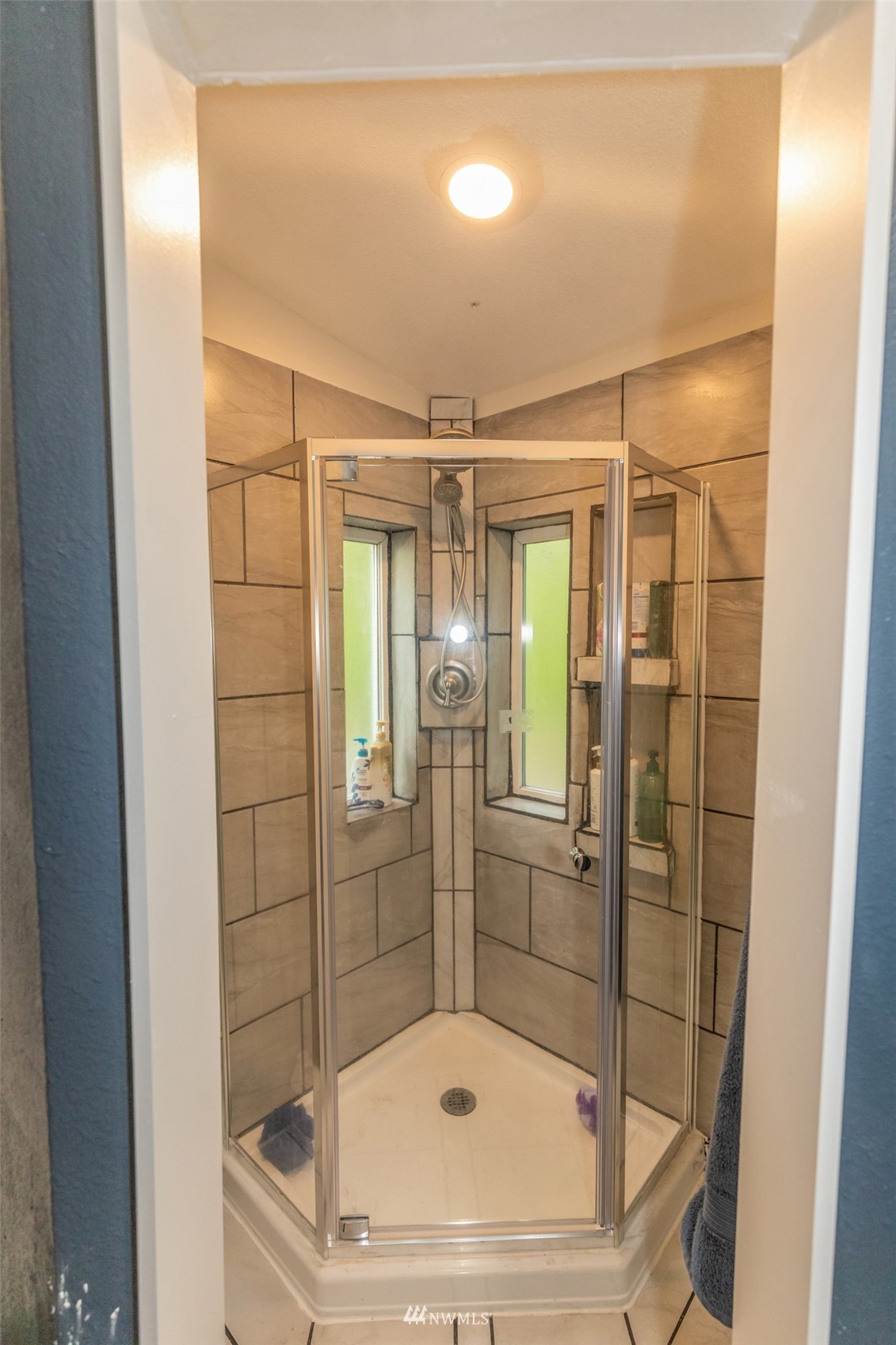 11205 180th Lane Southwest Rochester, WA 98579 - Photo 16 of 33 a bathroom with a glass door shower