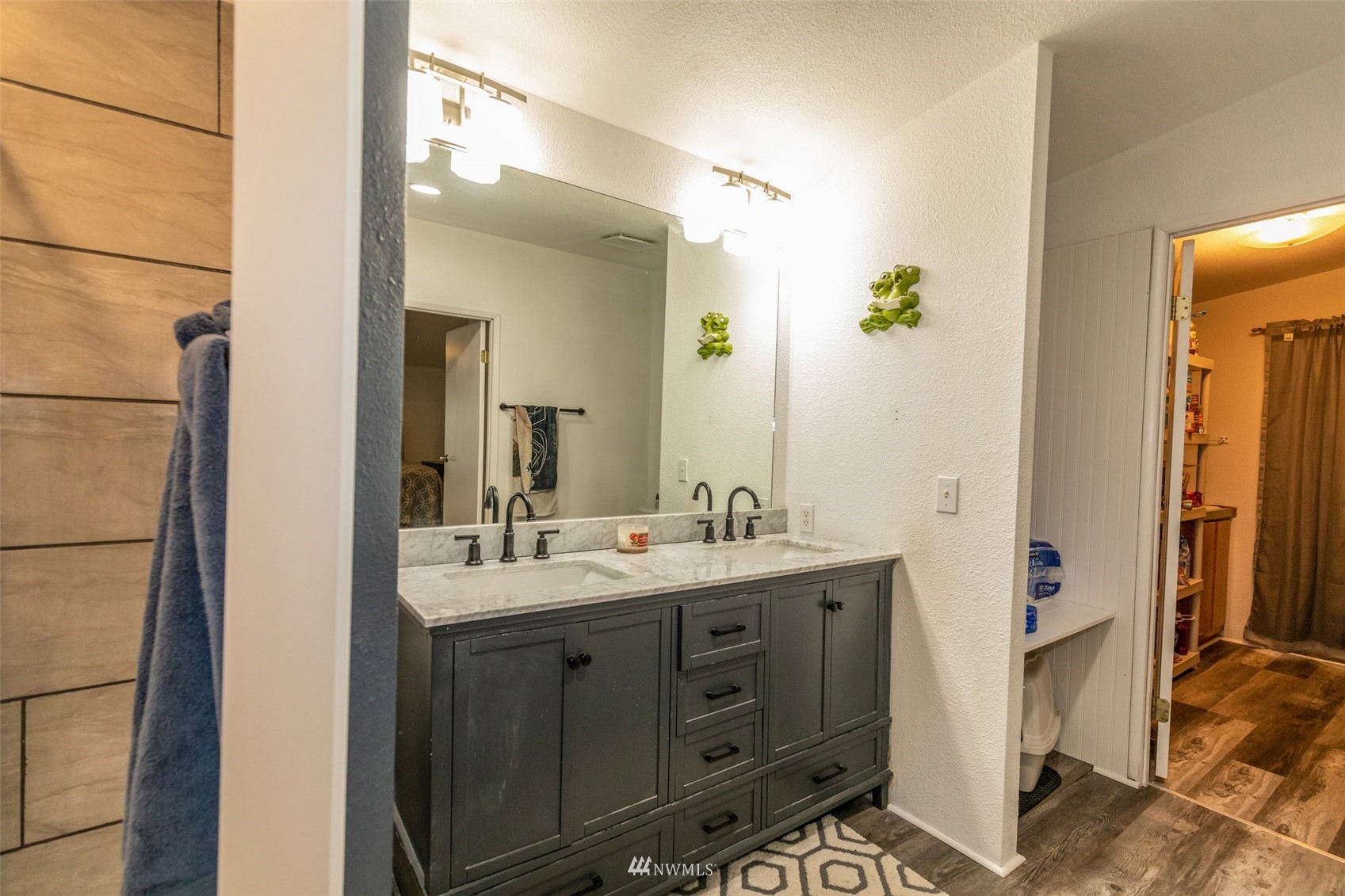 11205 180th Lane Southwest Rochester, WA 98579 - Photo 19 of 33 a bathroom with a double vanity sink and mirror