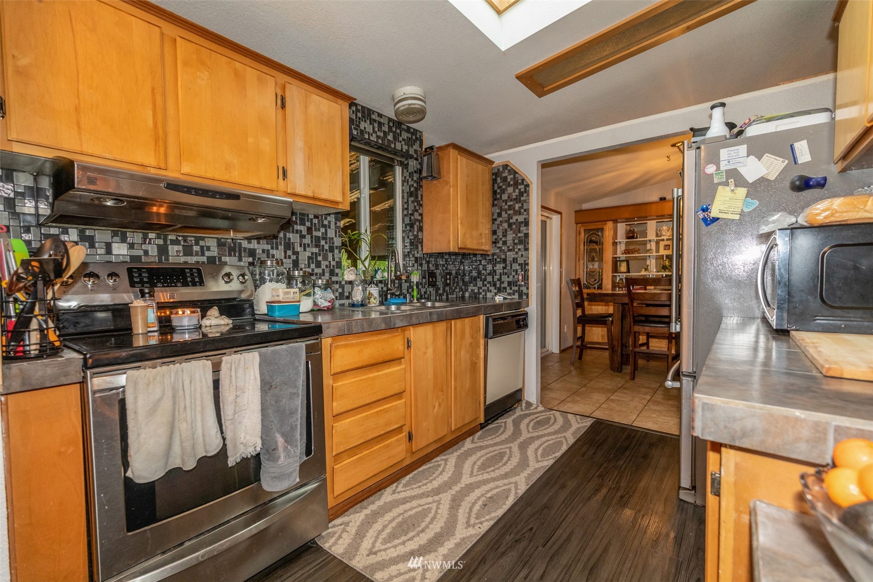 11205 180th Lane Southwest Rochester, WA 98579 - Photo 22 of 33 a kitchen with stainless steel appliances granite countertop a stove and cabinets