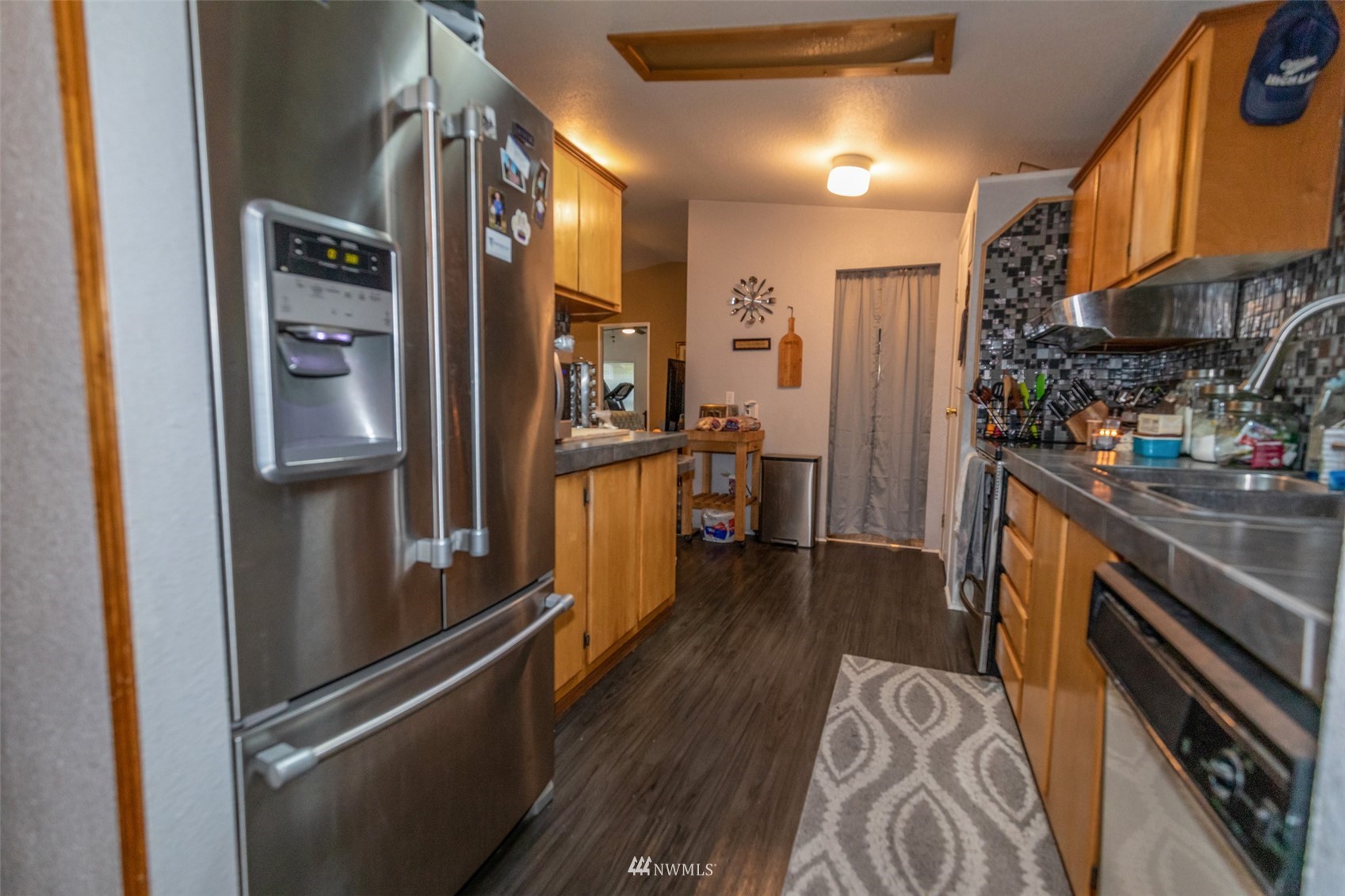 11205 180th Lane Southwest Rochester, WA 98579 - Photo 23 of 33 a kitchen with stainless steel appliances granite countertop a refrigerator and a stove