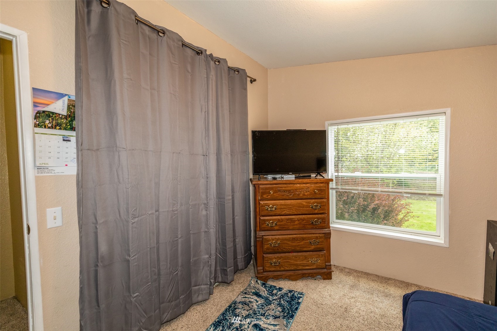 11205 180th Lane Southwest Rochester, WA 98579 - Photo 28 of 33 a view of room with window and flat screen tv