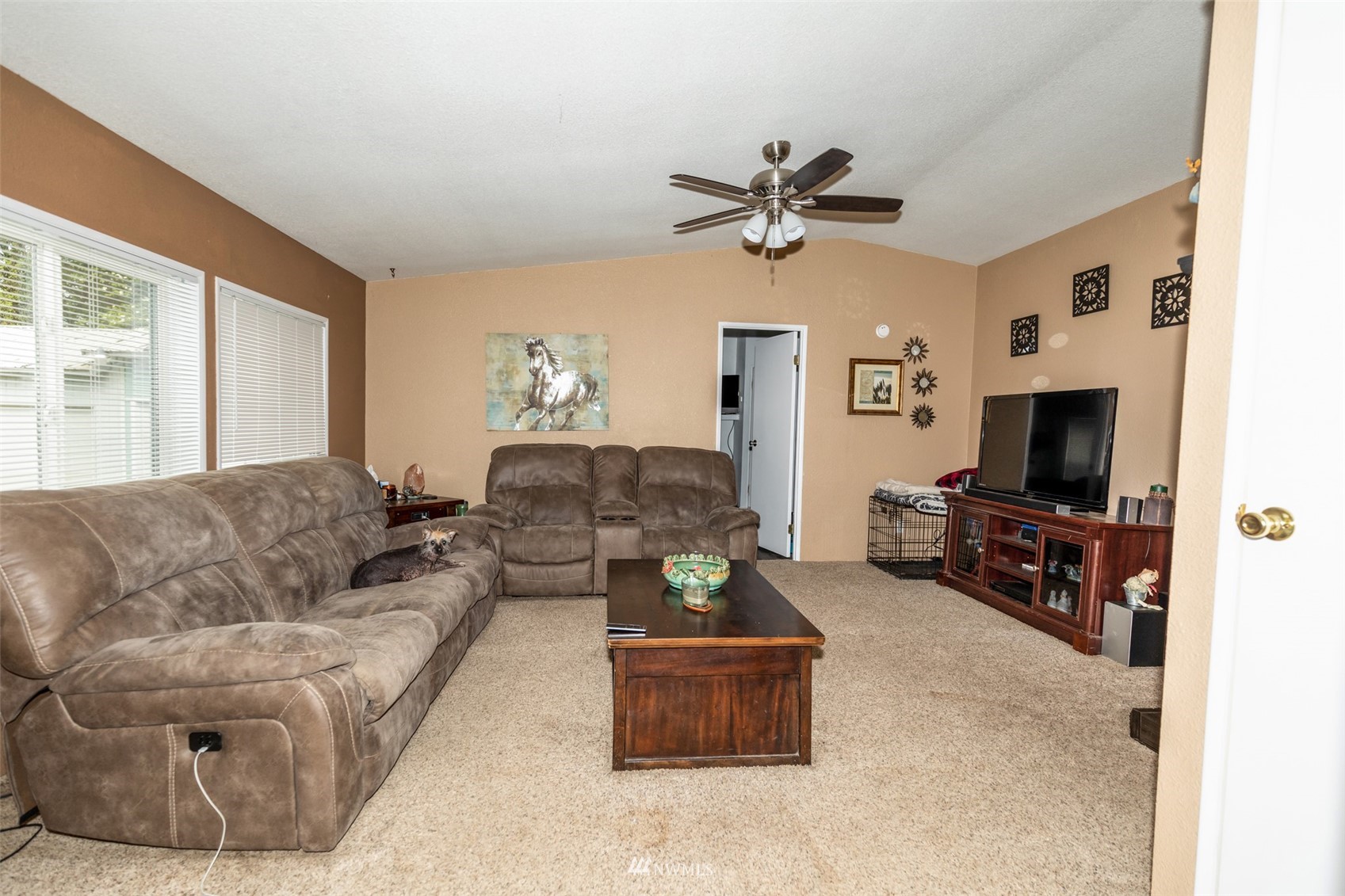 11205 180th Lane Southwest Rochester, WA 98579 - Photo 10 of 33 a living room with furniture and a flat screen tv