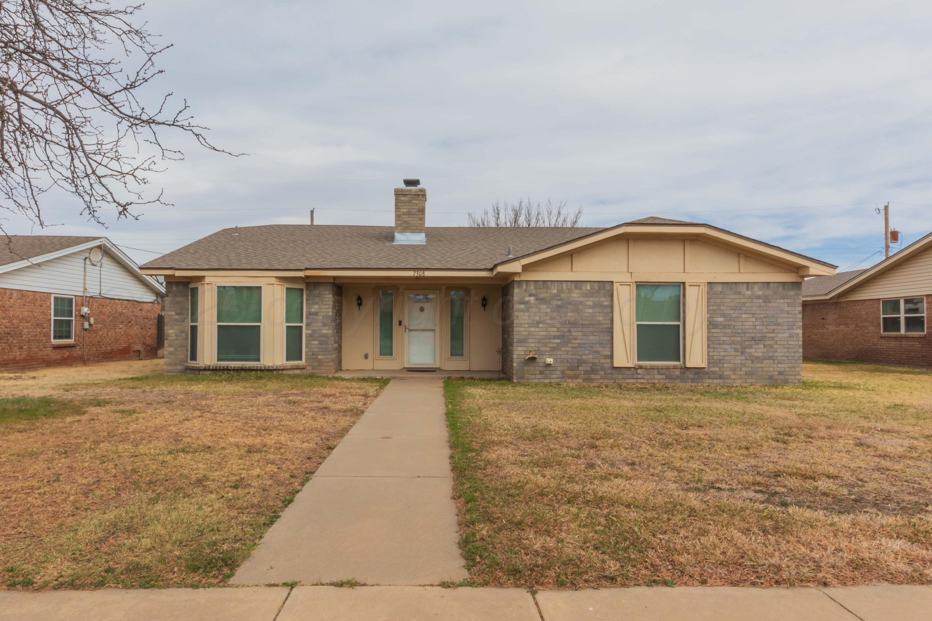 7308 Holyoke Trail Amarillo, TX 79121 - Photo 1 of 39 a front view of a house with a yard