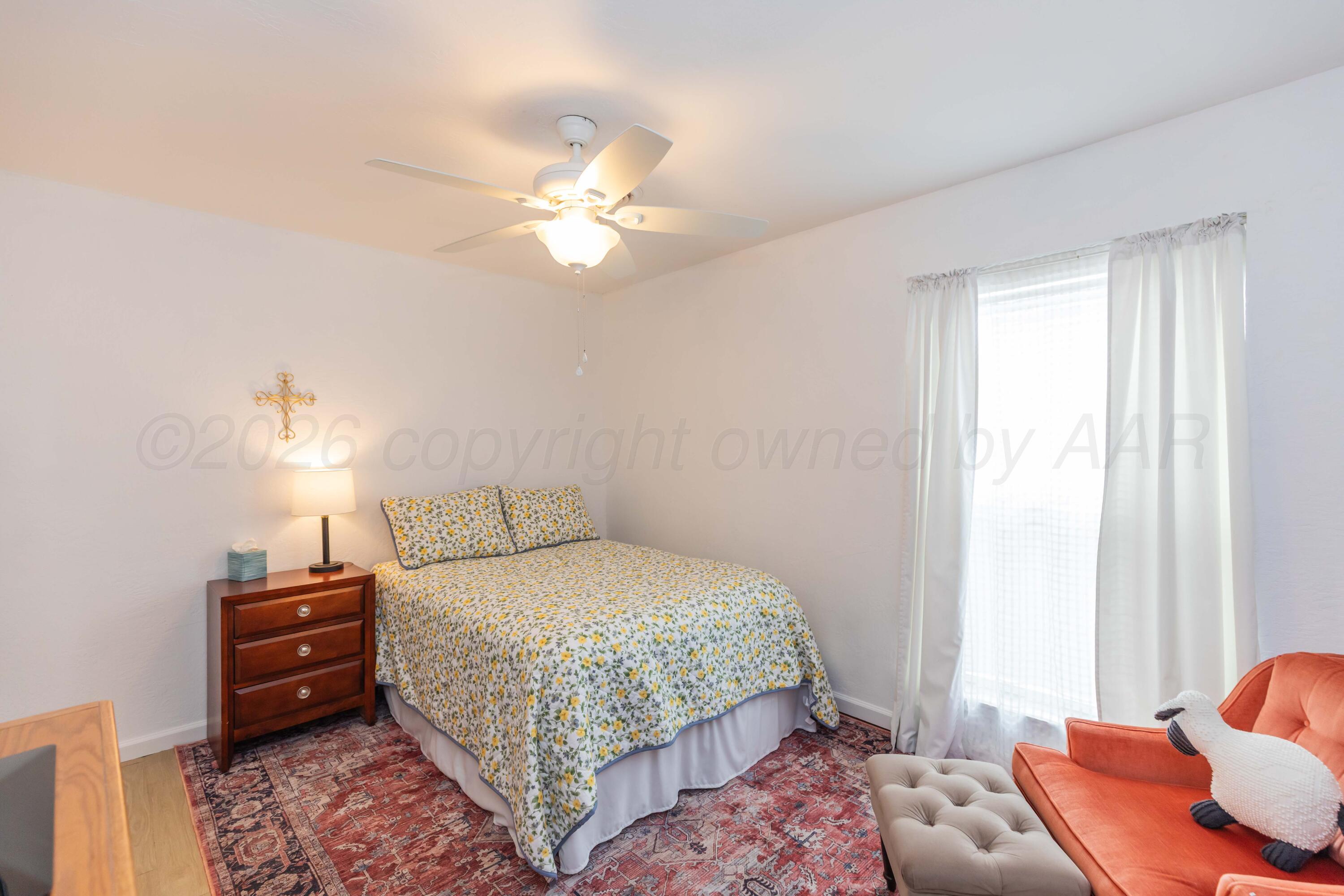 7308 Holyoke Trail Amarillo, TX 79121 - Photo 24 of 39 a bedroom with a bed and furniture