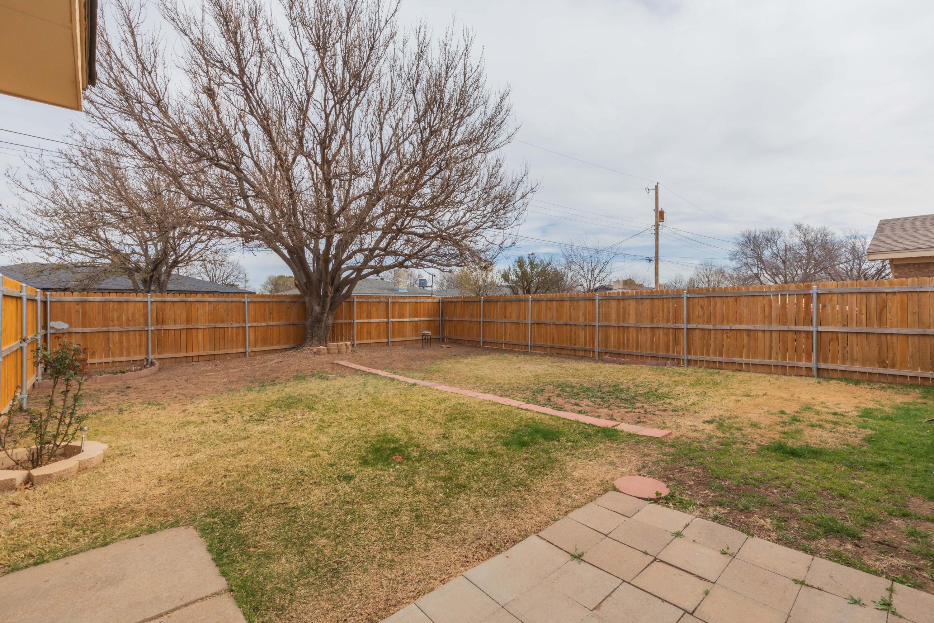 7308 Holyoke Trail Amarillo, TX 79121 - Photo 35 of 39 a view of backyard with wooden fence