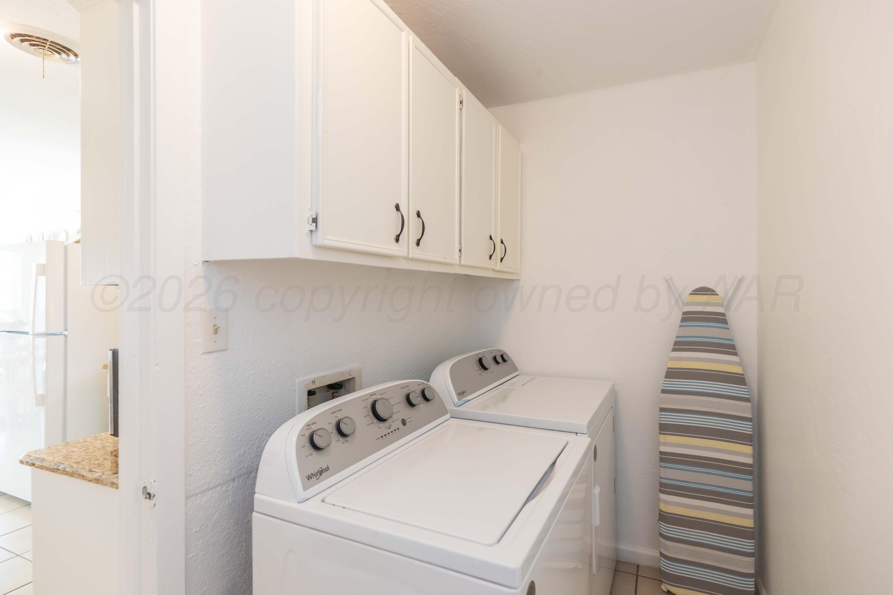 7308 Holyoke Trail Amarillo, TX 79121 - Photo 39 of 39 a utility room with dryer and washer