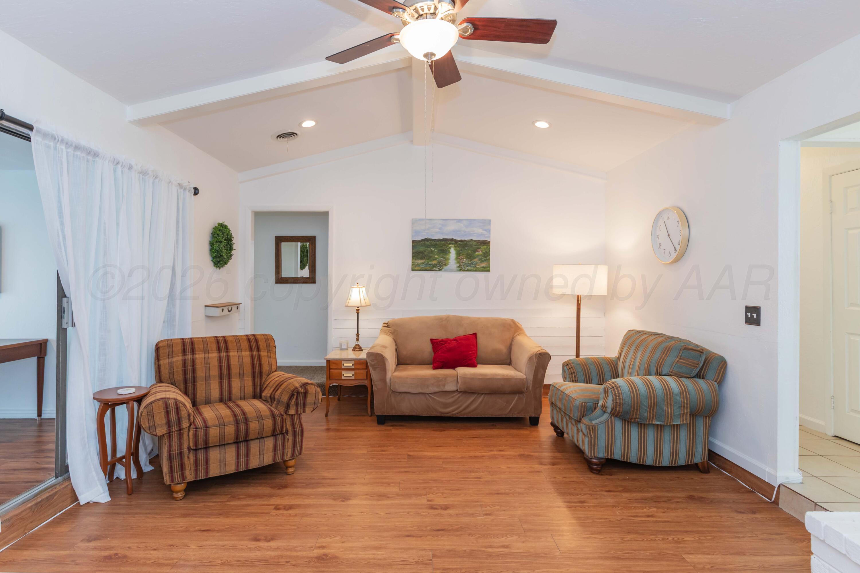 7308 Holyoke Trail Amarillo, TX 79121 - Photo 8 of 39 a living room with furniture and a couch